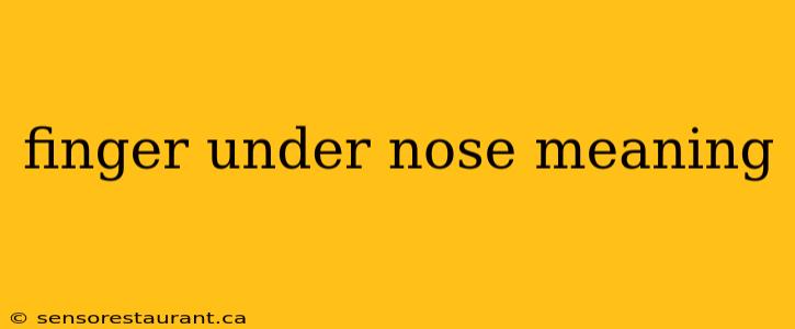 finger under nose meaning